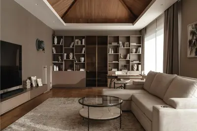 a living room with a couch and a table at Luxury Botanica Villa in Ban Phru Champa