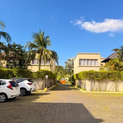 a street with cars parked in front of a building at The Residence Resort Pool Villa 2 Bedrooms and 2 Bathrooms in Ban Thalat Choeng Thale