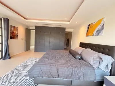 a bedroom with a large bed in a room at The Residence Resort Pool Villa 2 Bedrooms and 2 Bathrooms in Ban Thalat Choeng Thale