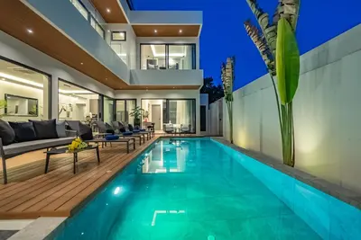 a swimming pool in a house with a villa at Dara Villas - Rawai in Rawai Beach