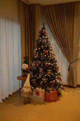 a christmas tree with a cat toy next to it at Bursuai - Lake view family pool Laguna Village in Ban Thalat Choeng Thale