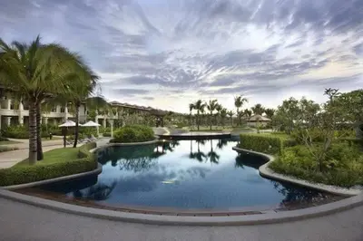 a swimming pool with palm trees in a resort at Bursuai - Lake view family pool Laguna Village in Ban Thalat Choeng Thale