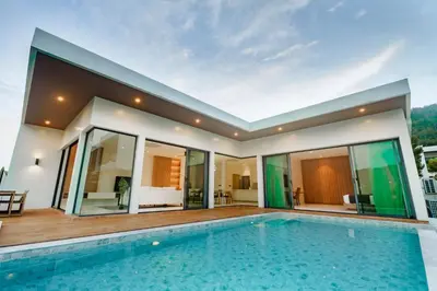 a villa with a swimming pool and a house at Niva Villa - Modern & Lake View near Phuket town in Ban Bang Khu