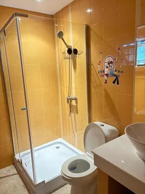 a bathroom with a shower with a toilet and a sink at NS Private Pool villa in Ban Na Kok