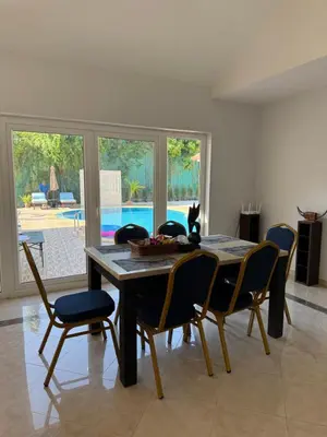 a dining room with a table and chairs at B&K private pool Villa in Rawai Beach