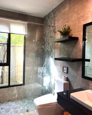 a bathroom with a shower and a toilet and a sink at 3-bdr Premium Villa in Nai Harn Baan Bua by Neo With Love in Phuket Town