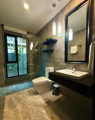 a bathroom with a sink and a toilet and a mirror at 3-bdr Premium Villa in Nai Harn Baan Bua by Neo With Love in Phuket Town
