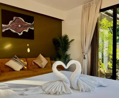 two swans making a heart on a bed at 3-bdr Premium Villa in Nai Harn Baan Bua by Neo With Love in Phuket Town