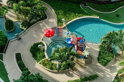 an overhead view of a swimming pool with a water park at Suite With Sea View By Mida Grande Resort in Ban Lum Fuang