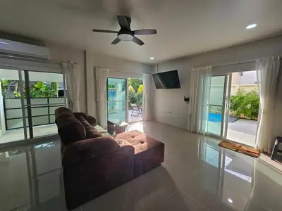 a living room with a couch and a ceiling fan at Rawai 4 Bedrooms Private Pool Villa in Rawai Beach