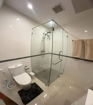 a bathroom with a glass shower and a toilet at Lai Thai Villa 5 in Rawai Beach