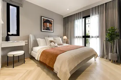a bedroom with a large bed and a window at Bangtao The Title Legendary by Phuket Sabay Rent I302 in Bang Tao Beach