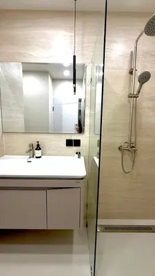 a bathroom with a sink and a shower at The Regent new apartment in Ban Thalat Choeng Thale