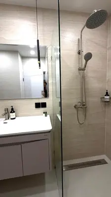 a bathroom with a shower and a sink at The Regent new apartment in Ban Thalat Choeng Thale