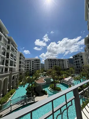 a view of the pool from the balcony of a resort at Title Legendary suite pool view E301 in Phuket