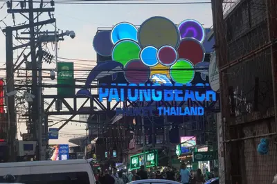 a sign on a street in a city at Patong Condo Tub, Roof Pool & 2-min to Beach in Patong Beach
