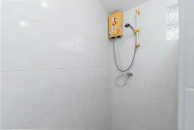 a white bathroom with a shower with a yellow phone at V278 Quiet Poolside 3BR Villa for Relaxed Stays in Ban Bang Chak