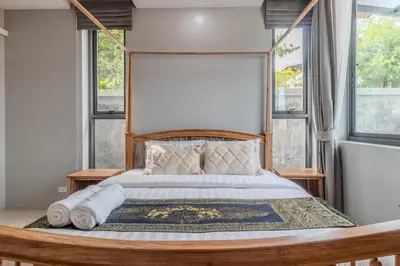 a bedroom with a large bed with a large window at V280 If You Need Luxury This Is The Place Fully Smart in Ban Saiyuan (1)