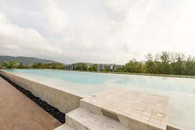 a large swimming pool on top of a building at Apartments in the center of Laguna in Laguna Phuket