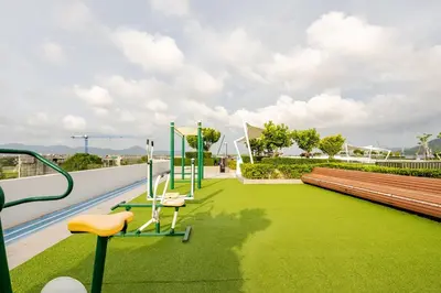 a park with a bench and a swing at Apartments in the center of Laguna in Laguna Phuket