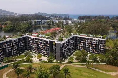an aerial view of an apartment complex with buildings at Apartments in the center of Laguna in Laguna Phuket