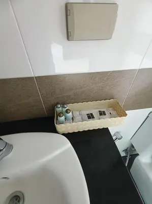 a bathroom with a white toilet and a sink at \u82ad\u4e1c\u4e00\u5367\u5927\u5e8a\u623f\u72ec\u7acb\u6dcb\u6d74\u9633\u53f0 in Patong Beach