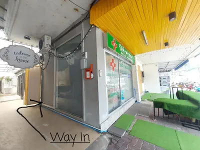 a view of a shop with a way in sign on the wall at FanRoomGroundFlNonehotshower in Ban Ket Ho