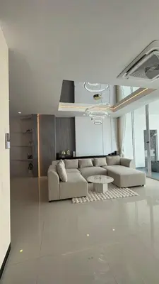a living room with a couch and a table at Luxury villa with sea view, pool and maid in Patong Beach
