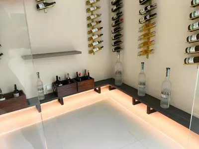 a wine cellar with bottles and lights in a room at Luxury villa with sea view, pool and maid in Patong Beach
