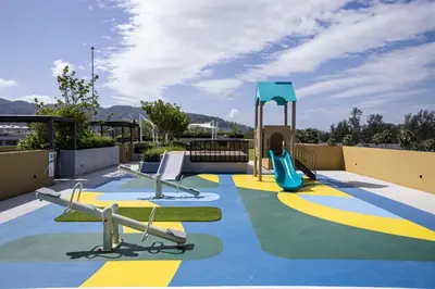 a playground with a slide and a swing at Premium 1BR Laguna, 200m to the Beach in Bang Tao in Bang Tao Beach