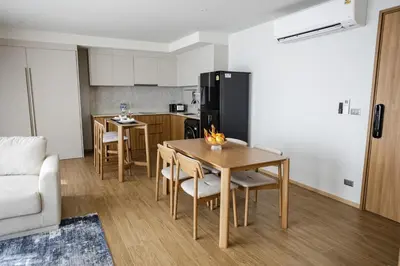 a kitchen and dining room with a table and chairs at Premium 1BR Laguna, 200m to the Beach in Bang Tao in Bang Tao Beach