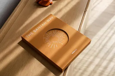 a book sitting on top of a table at Premium 1BR Laguna, 200m to the Beach in Bang Tao in Bang Tao Beach