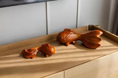 two wooden animals sitting on top of a dresser at Premium 1BR Laguna, 200m to the Beach in Bang Tao in Bang Tao Beach
