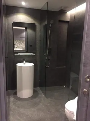 a bathroom with a shower and a sink and a toilet at luxury apartment at Kamala in Kamala Beach