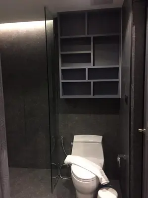 a bathroom with a toilet with a glass door at luxury apartment at Kamala in Kamala Beach