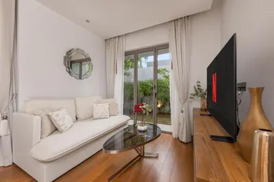a living room with a white couch and a glass table at Private 3BR Pool Villa Mana at Anchan Tropicana in Ban Phru Champa