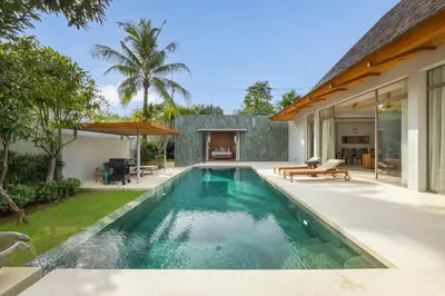 a swimming pool in the backyard of a house at Private 3BR Pool Villa Mana at Anchan Tropicana in Ban Phru Champa