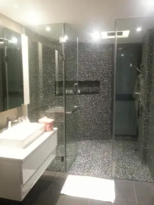 a bathroom with a shower and a sink and a shower at Resort Sea View Apartment Patong in Patong Beach