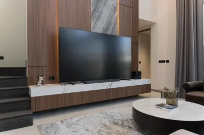 a living room with a large flat screen tv at Grand View Family Villa 5 min to Beach in Ban Thalat Choeng Thale