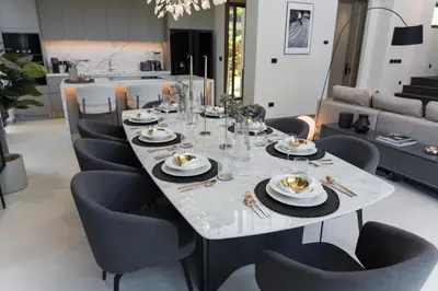 a dining room with a table and chairs at Grand View Family Villa 5 min to Beach in Ban Thalat Choeng Thale