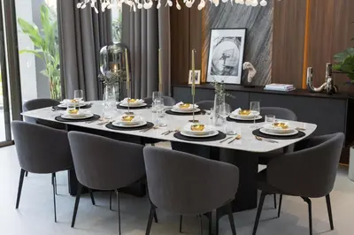 a dining room table with chairs and a large table with plates at Grand View Family Villa 5 min to Beach in Ban Thalat Choeng Thale
