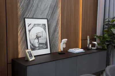 a shelf with a picture and a statue on it at Grand View Family Villa 5 min to Beach in Ban Thalat Choeng Thale