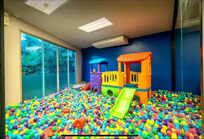 a childs room with a toy heap of balls at Karon Beach Forest View in Ban Karon