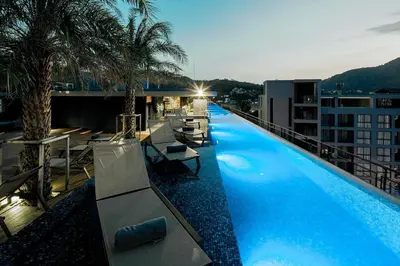 a large swimming pool on top of a building at Citygate condo at Kamala Beach in Kamala Beach