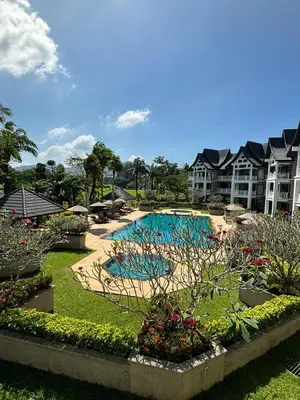 a large swimming pool in a resort with buildings at Allamanda 2 Laguna Phuket luxuries 1 bedroom in Laguna Phuket