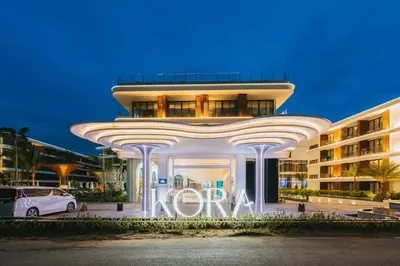 a building with a sign that reads koya at Hydra 1BR Suite at Kora Beach Resort in Layan Beach
