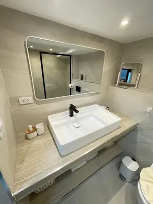 a bathroom with a white sink and a mirror at Seaview paradise in Patong Beach