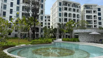 a swimming pool in a park with buildings at Cozy Apartment 1 km to Bangtao beach in Bang Tao Beach