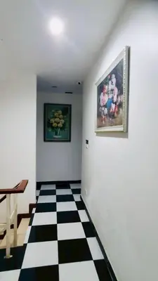 a room with a black and white checkered floor at TK Apartment By Wijitra in Ban Saiyuan (1)