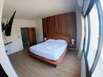 a bedroom with a large white bed and a window at Rawai 2 Bedrooms Private Pool Villa in Ban Saiyuan (1)